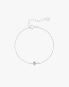 Delicate silver chain bracelet with a central star-shaped charm, adjustable clasp, and heart tag. Perfect for elegant jewelry lovers.