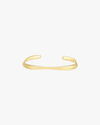 Gold minimalist open cuff bracelet on white background, sleek and modern jewelry accessory, perfect for elegant fashion styling and gifting.