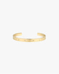 Gold cuff bracelet with star-shaped diamond accents on a white background. Elegant jewelry piece, perfect for fashion accessories and luxury style.