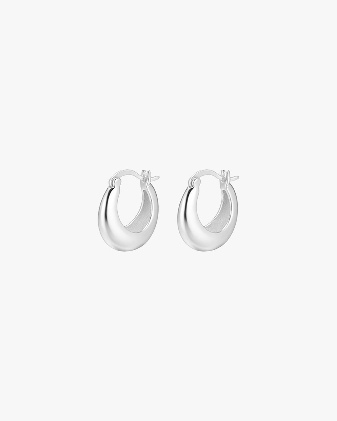 Silver hoop earrings on white background, minimalist jewelry, small round design, polished finish, women's fashion accessories, elegant style.