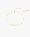Gold chain bracelet with a rectangular bar featuring a single diamond, adjustable link chain, minimalist jewelry, elegant accessory for women.