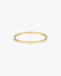 Gold bangle bracelet on white background, minimalist jewelry design, sleek and elegant accessory, perfect for fashion-forward style enthusiasts.
