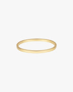 Gold bangle bracelet on white background, minimalist jewelry design, sleek and elegant accessory, perfect for fashion-forward style enthusiasts.