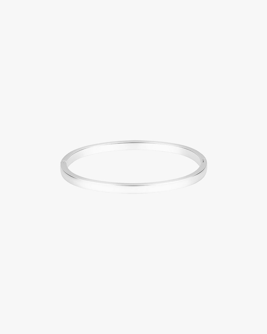 Silver bangle bracelet on white background, minimalist jewelry design, sleek and elegant accessory, perfect for fashion-forward style enthusiasts.