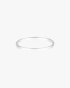 Silver bangle bracelet on white background, minimalist jewelry design, sleek and elegant accessory, perfect for fashion-forward style enthusiasts.