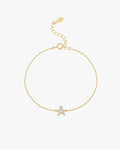 Gold chain bracelet with a diamond-studded letter "A" charm, featuring an adjustable clasp. Elegant jewelry accessory for personalized style.