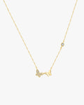 Gold butterfly necklace with diamond accents on a delicate chain, featuring a sparkling butterfly charm and a single diamond, elegant jewelry piece.